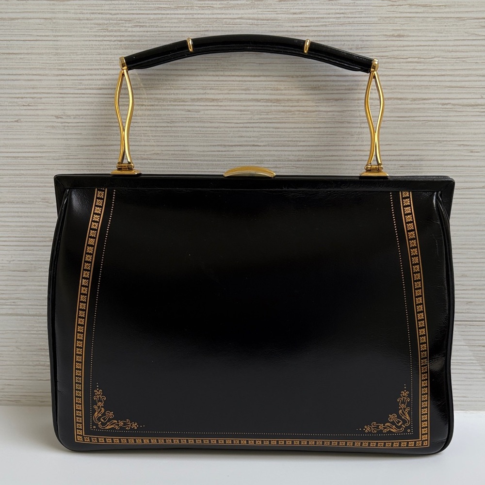 Elegant Black Handbag with Gold Accents